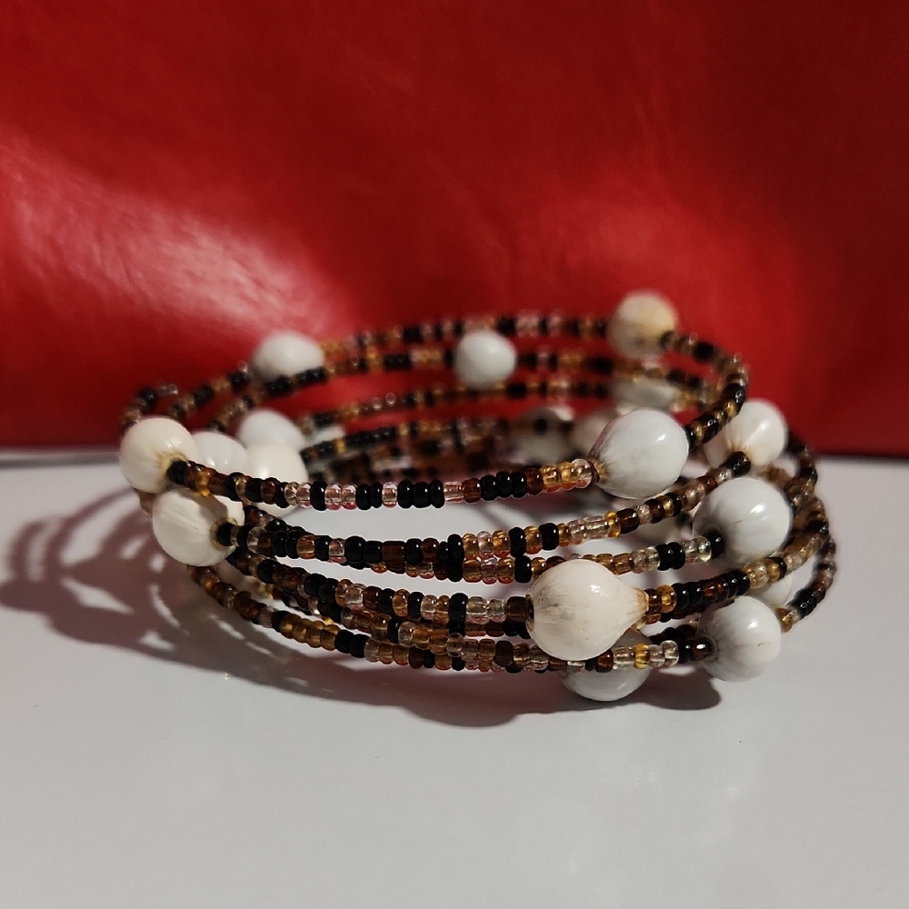 Multi-strand African waist bead bracelet featuring Black, gold, Brown